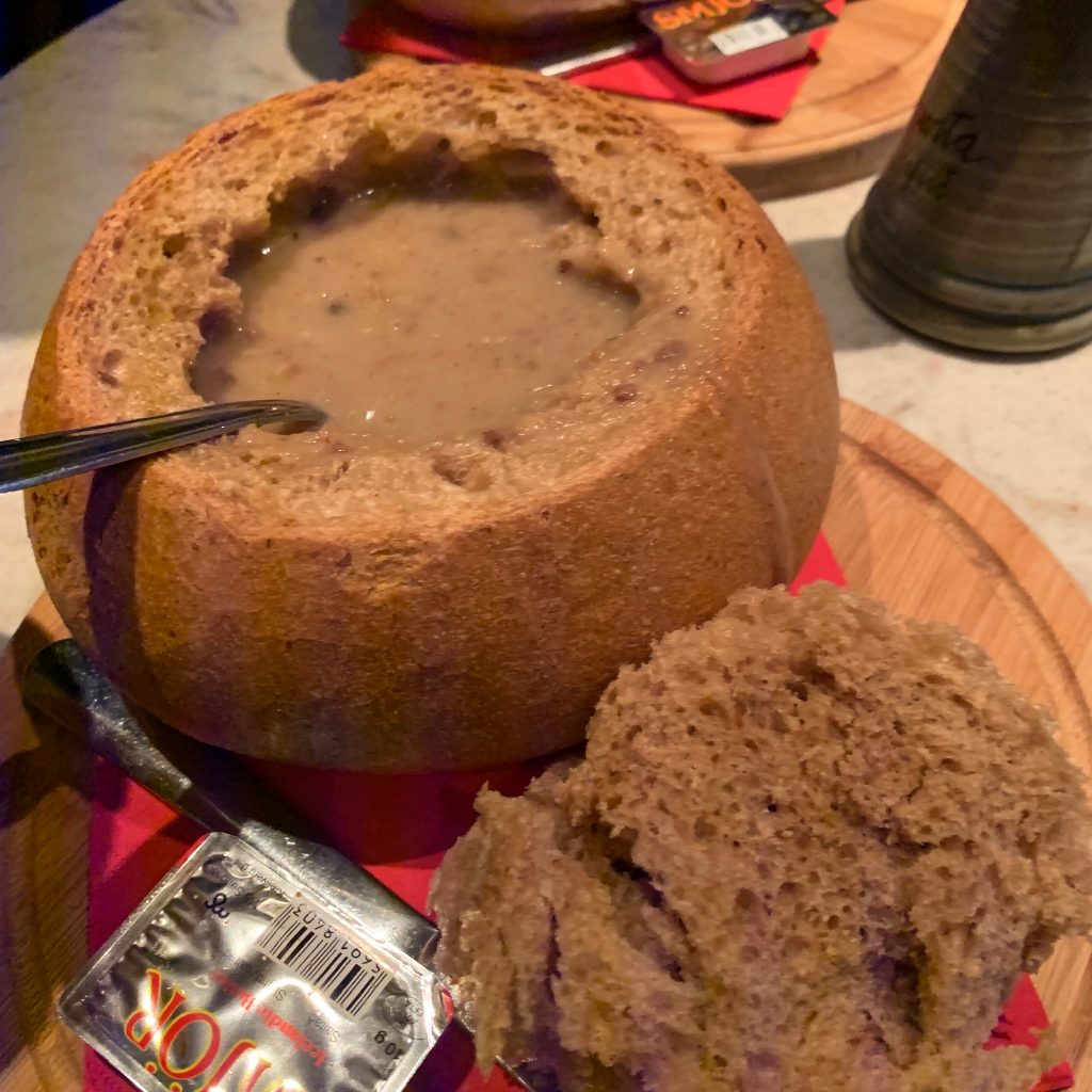 Reindeer soup in a bowl made out of bread.
