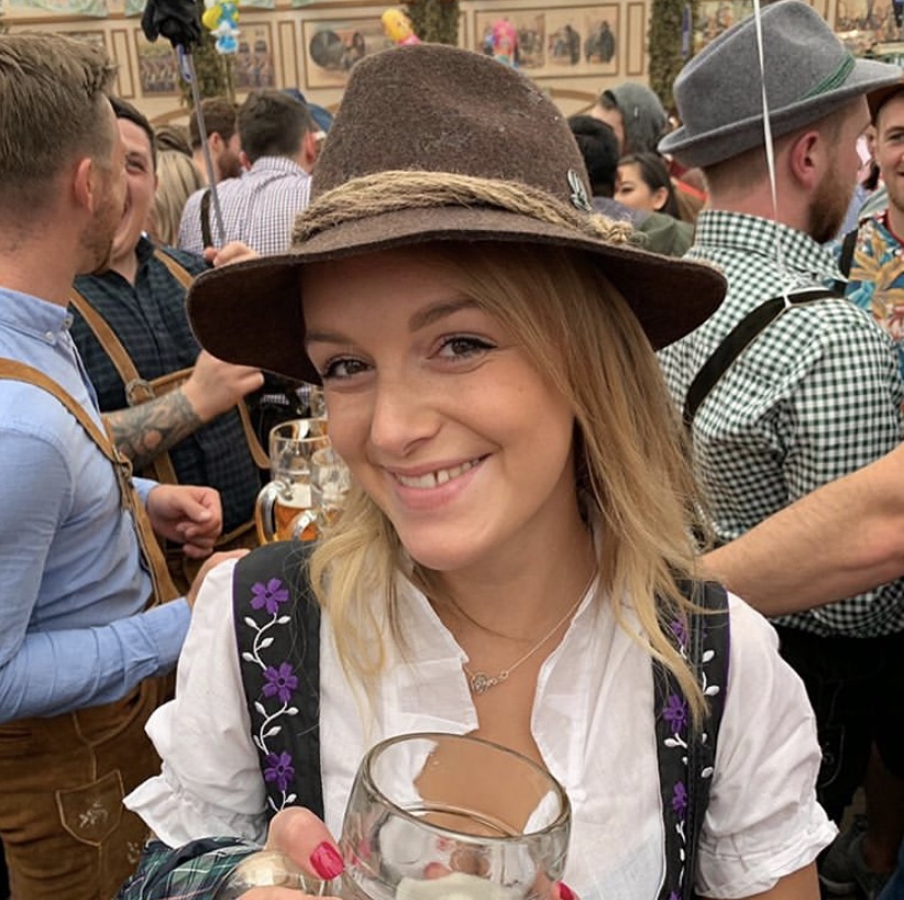 A woman with a bavarian hat - what to do at oktoberfest