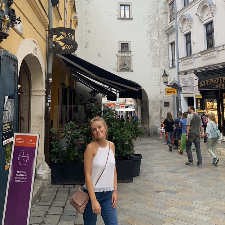 A woman stood in front of St. Michael's gate. Advised to visit from the Bratislava travel guide.