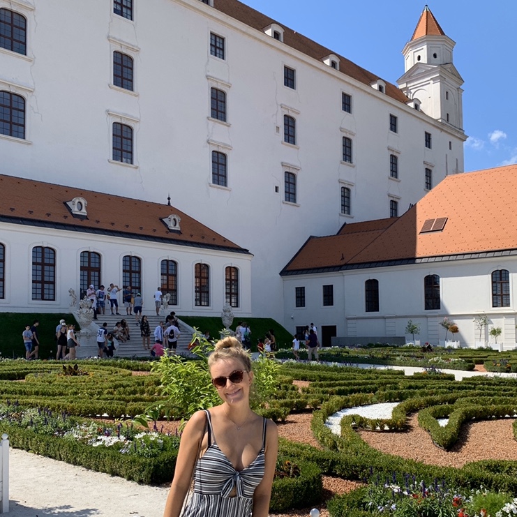 A woman in the gardens next to Bratislava castle.