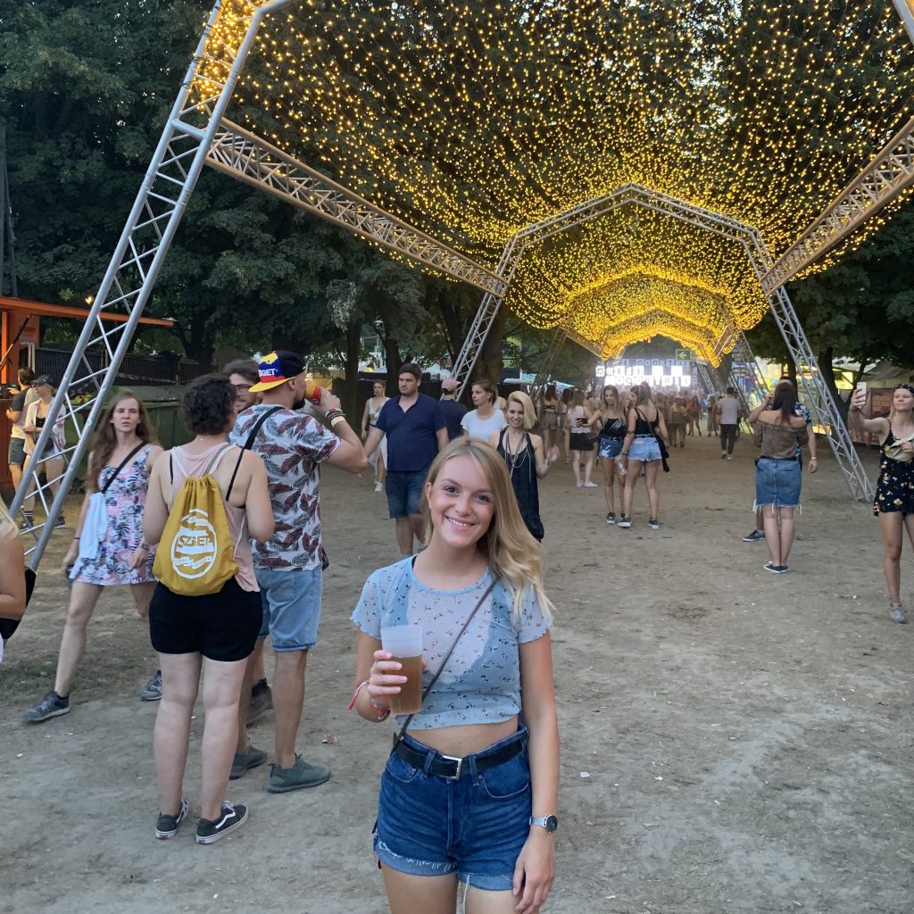 A person in front of decorations at Sziget festival, as part of the Sziget budapest guide
