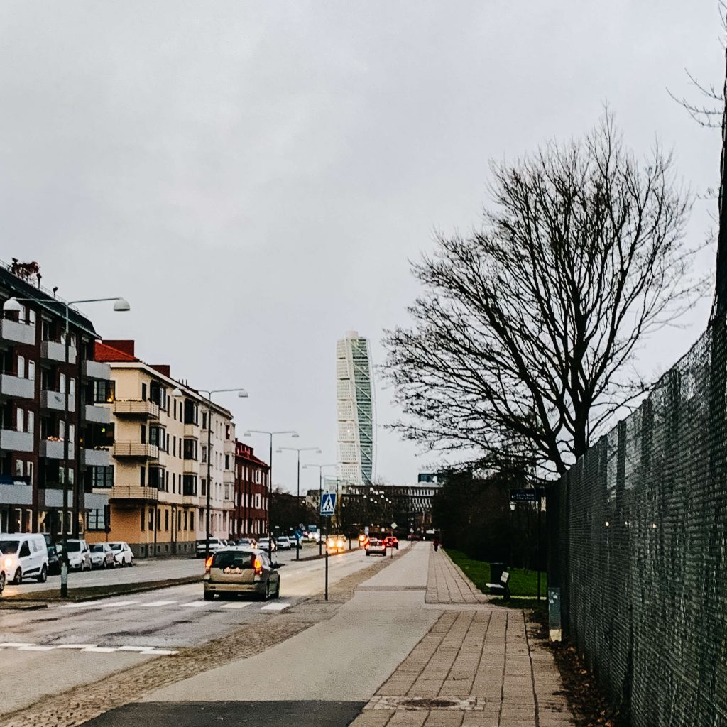 Turning torso tower from the distance with roads in the background