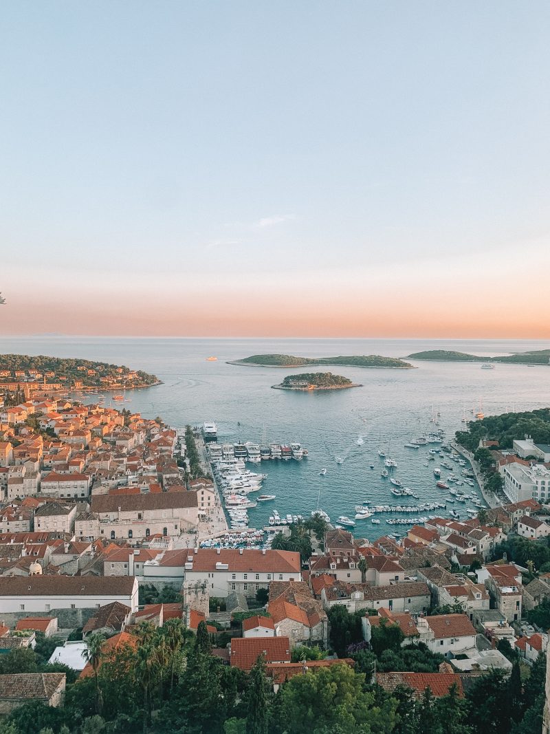 A view of Hvar near the castle during sunset. Pakleni islands and ocean can be seen. Things to do in Hvar