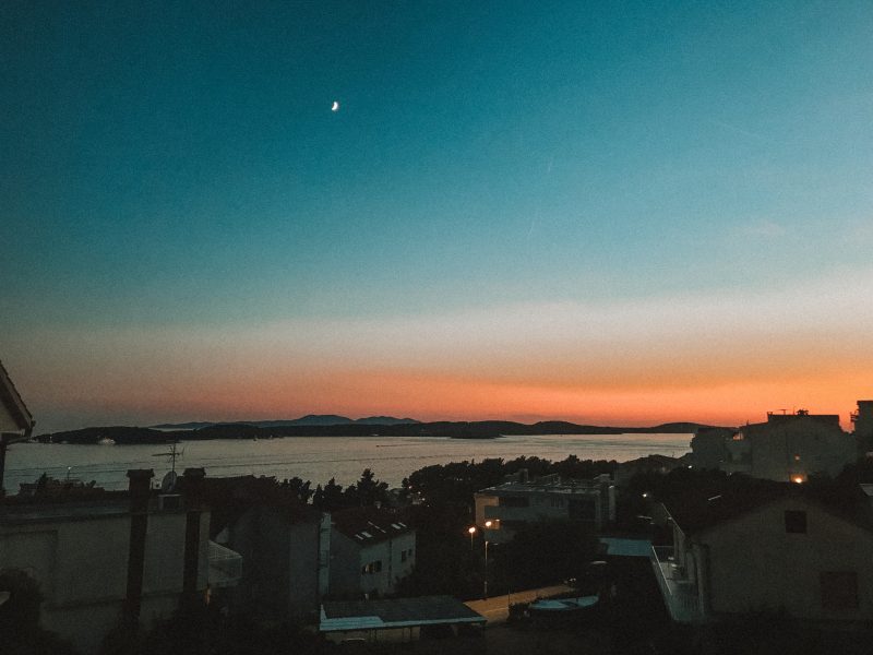 Dusk and sunset in Hvar. Orange skies and the moon. Where to go in Hvar