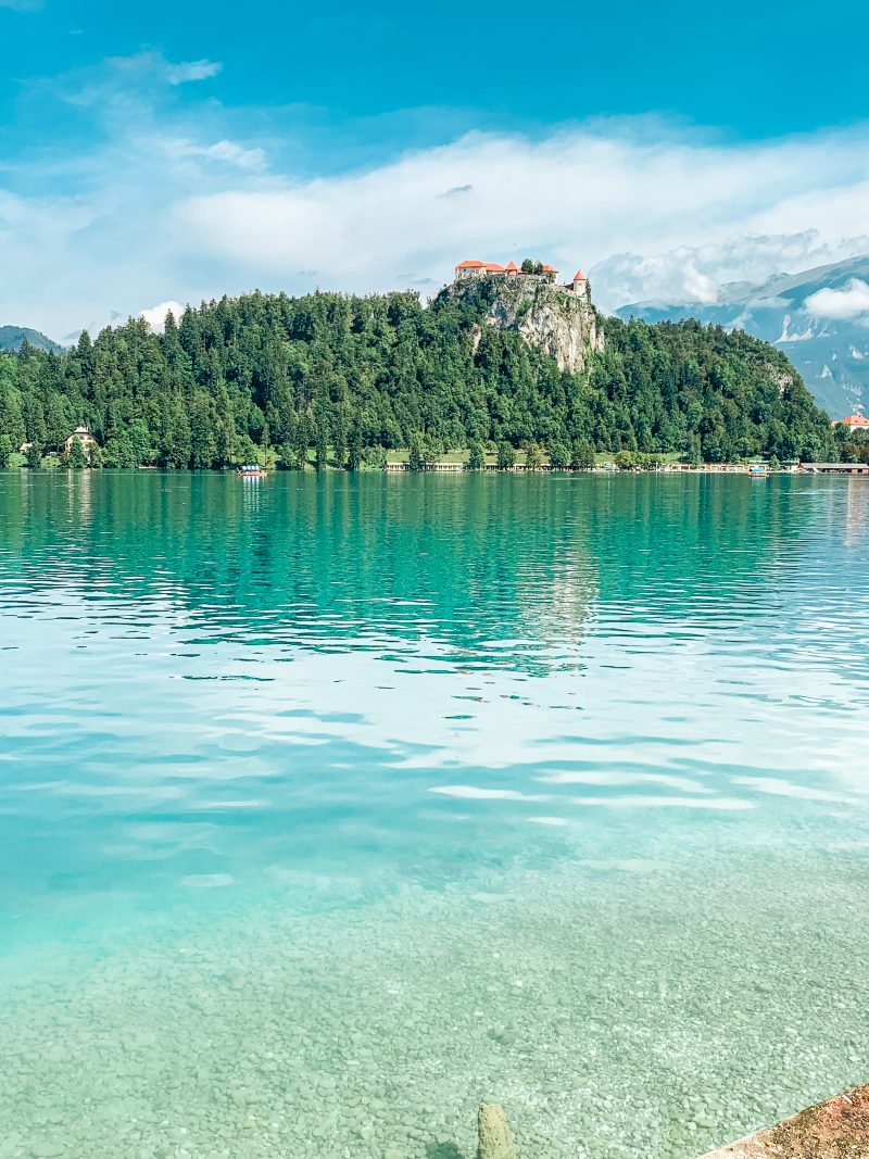 Turquoise water at Lake Bled with the castle in the background. Things to do at Lake Bled