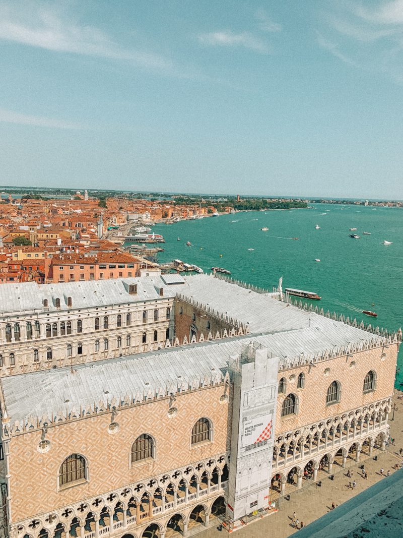 Aerial view of Venice with buildings and ocean in view. What to do in Venice