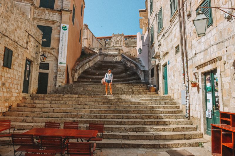 A woman stood on the spanish looking steps in Dubrovnik. What to do in Dubrovnik