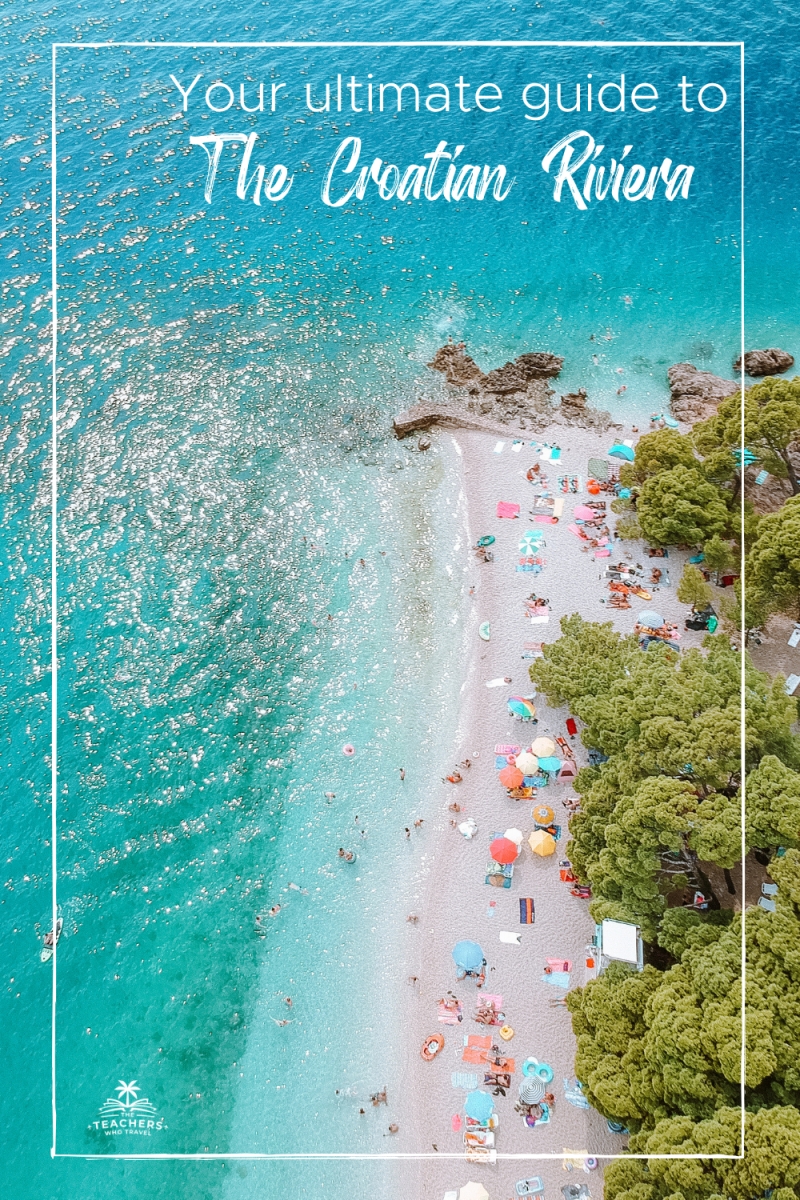 An aerial view of the coast in the Croatian Riviera. Turquoise waters and pine trees.