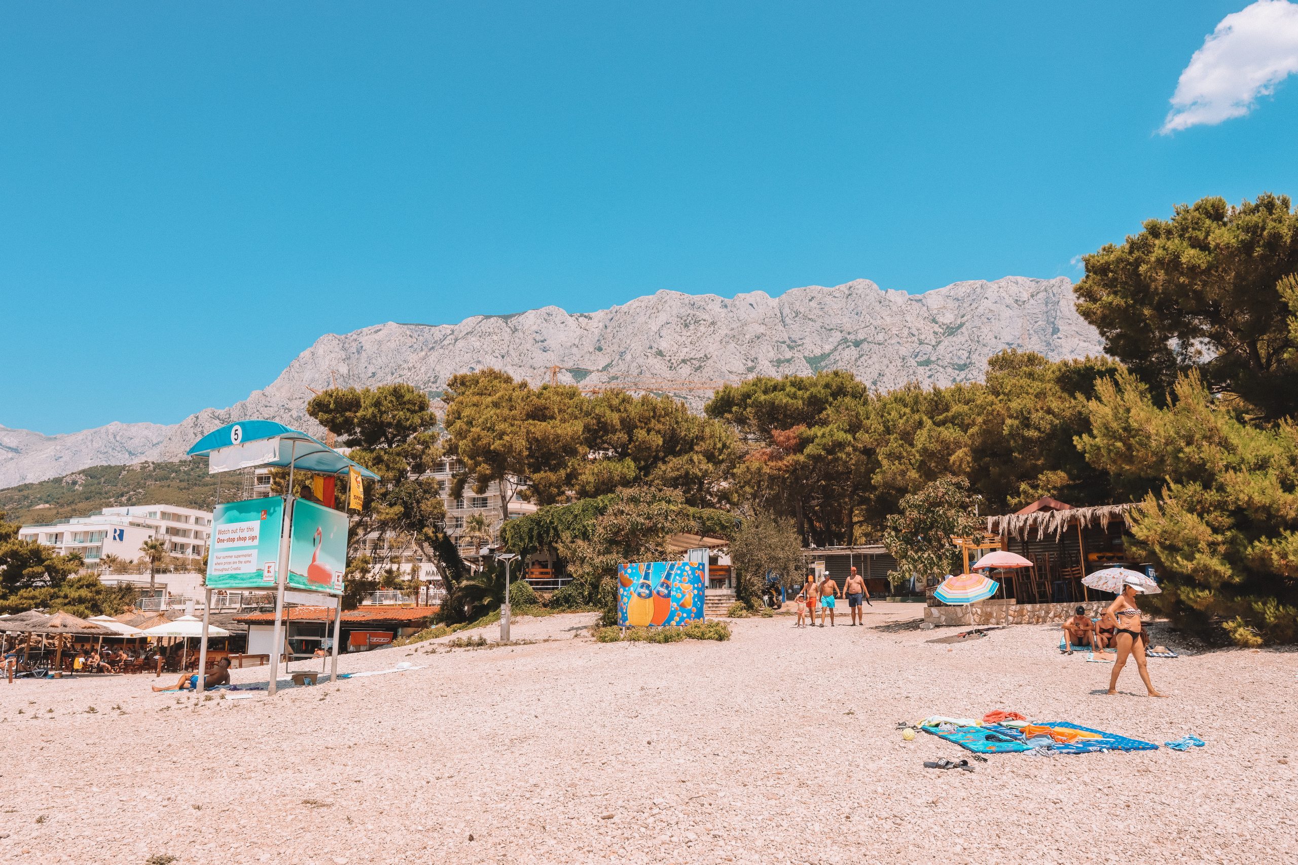 Cvitačka Beach with mountains in the background. Things to do in the Croatian Riviera