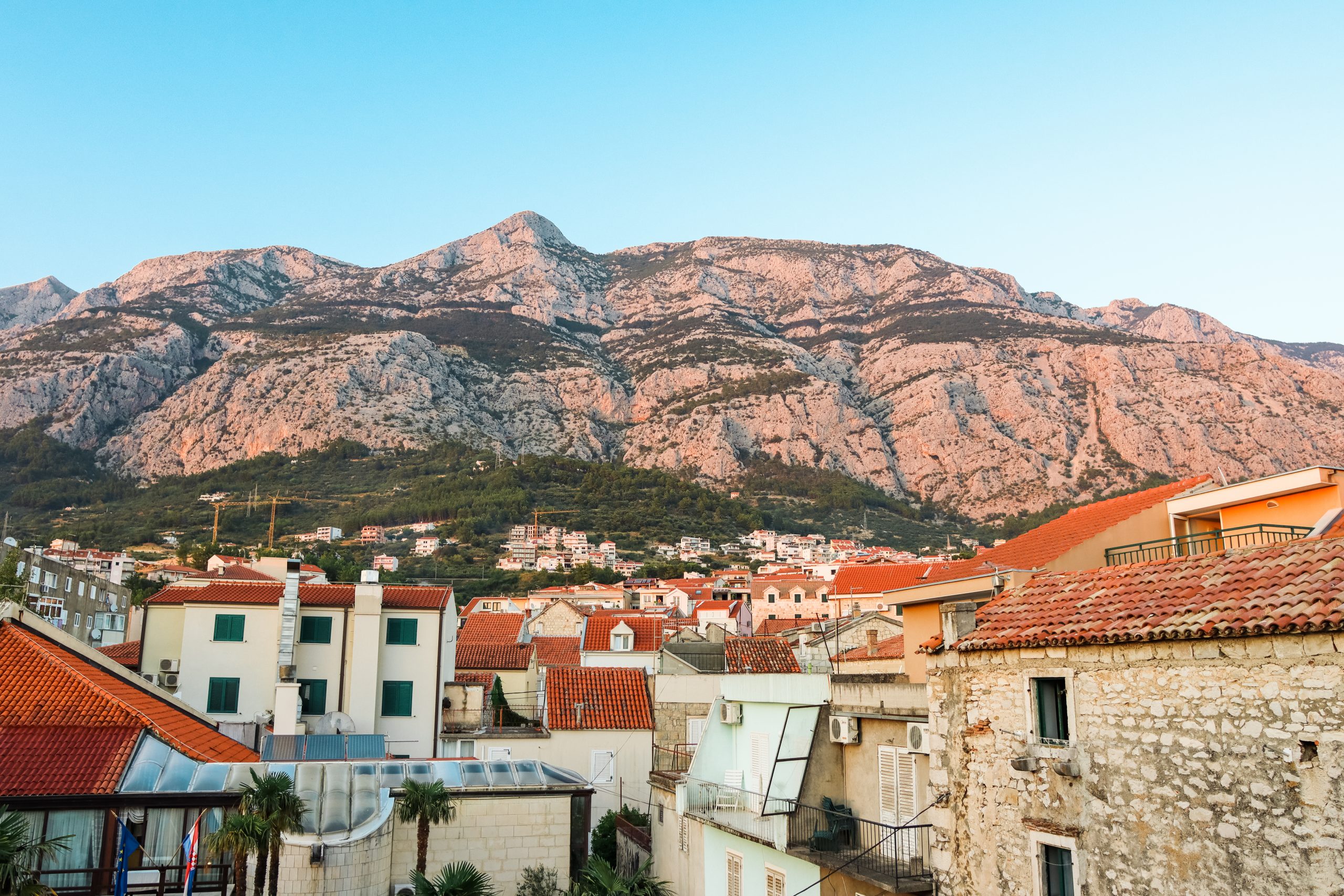Mountains during sunset with Makarksa old town in the background. Things to see in Makarska