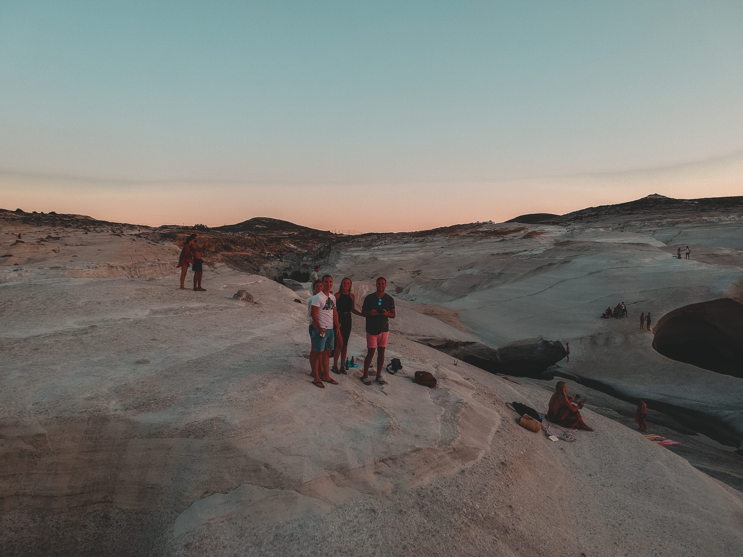 A group taking a selfie on the Sarakiniko rocks