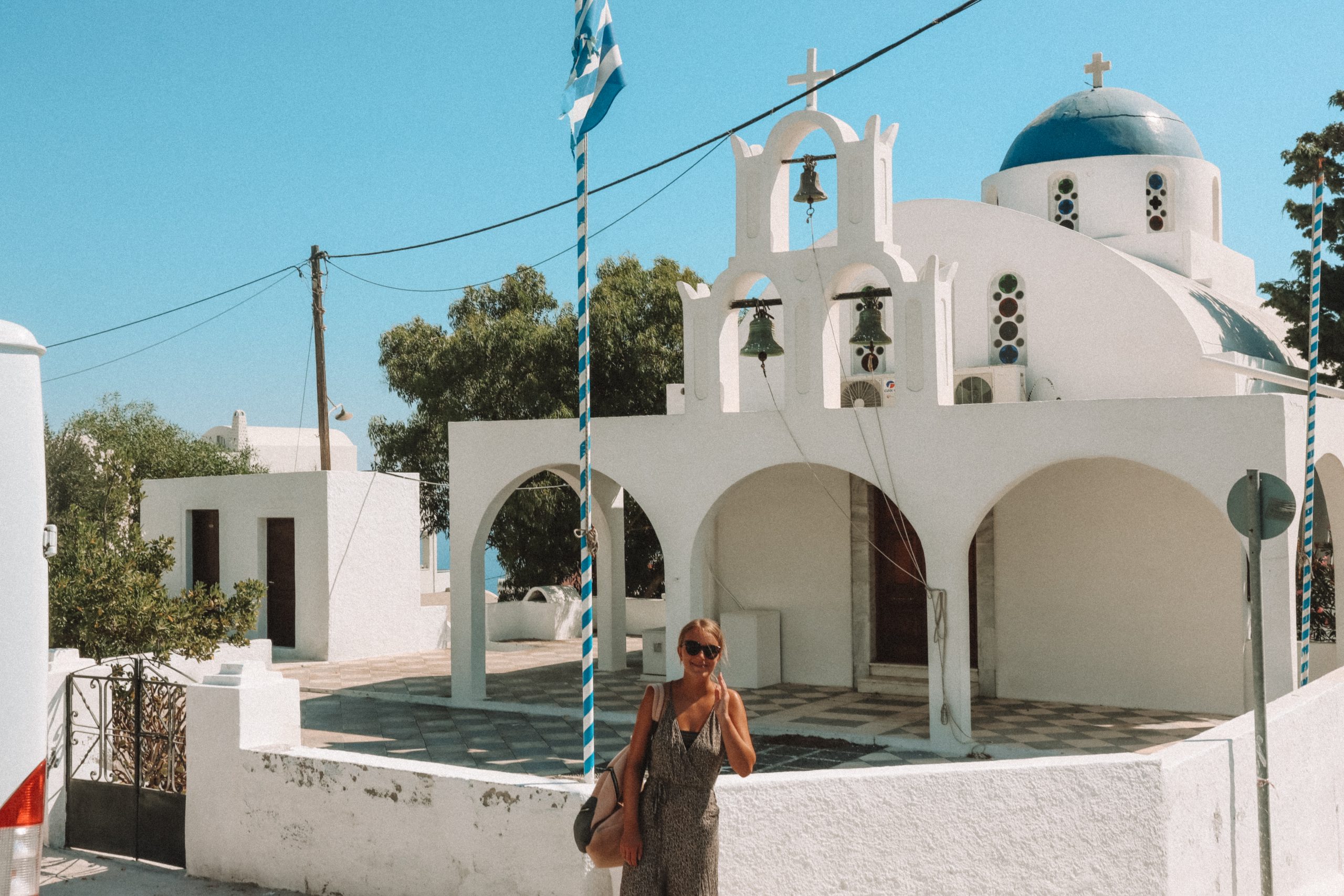 A woman stood in front of a church in Imerovigli