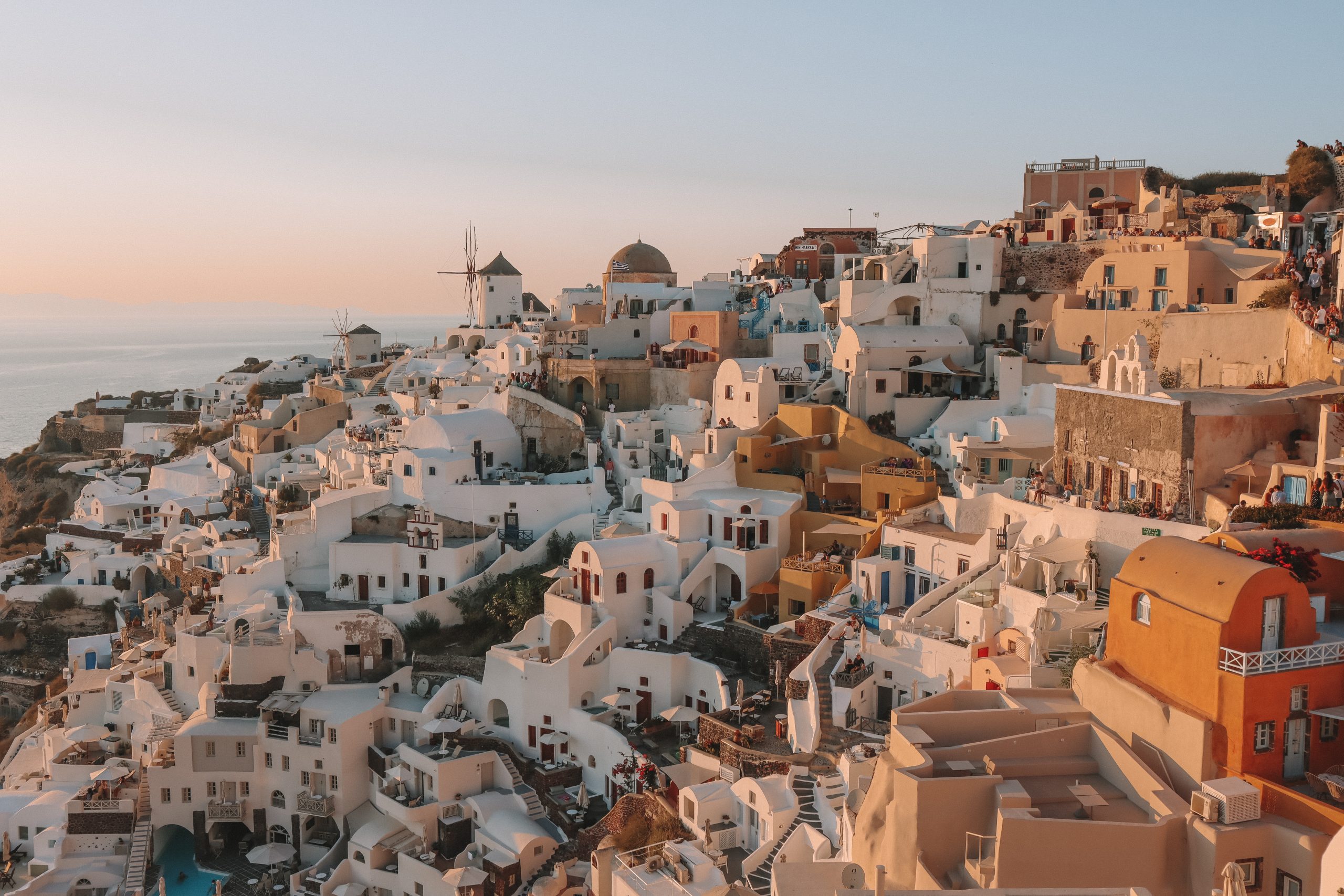 Oia buildings during sunset with a view from the Kastro