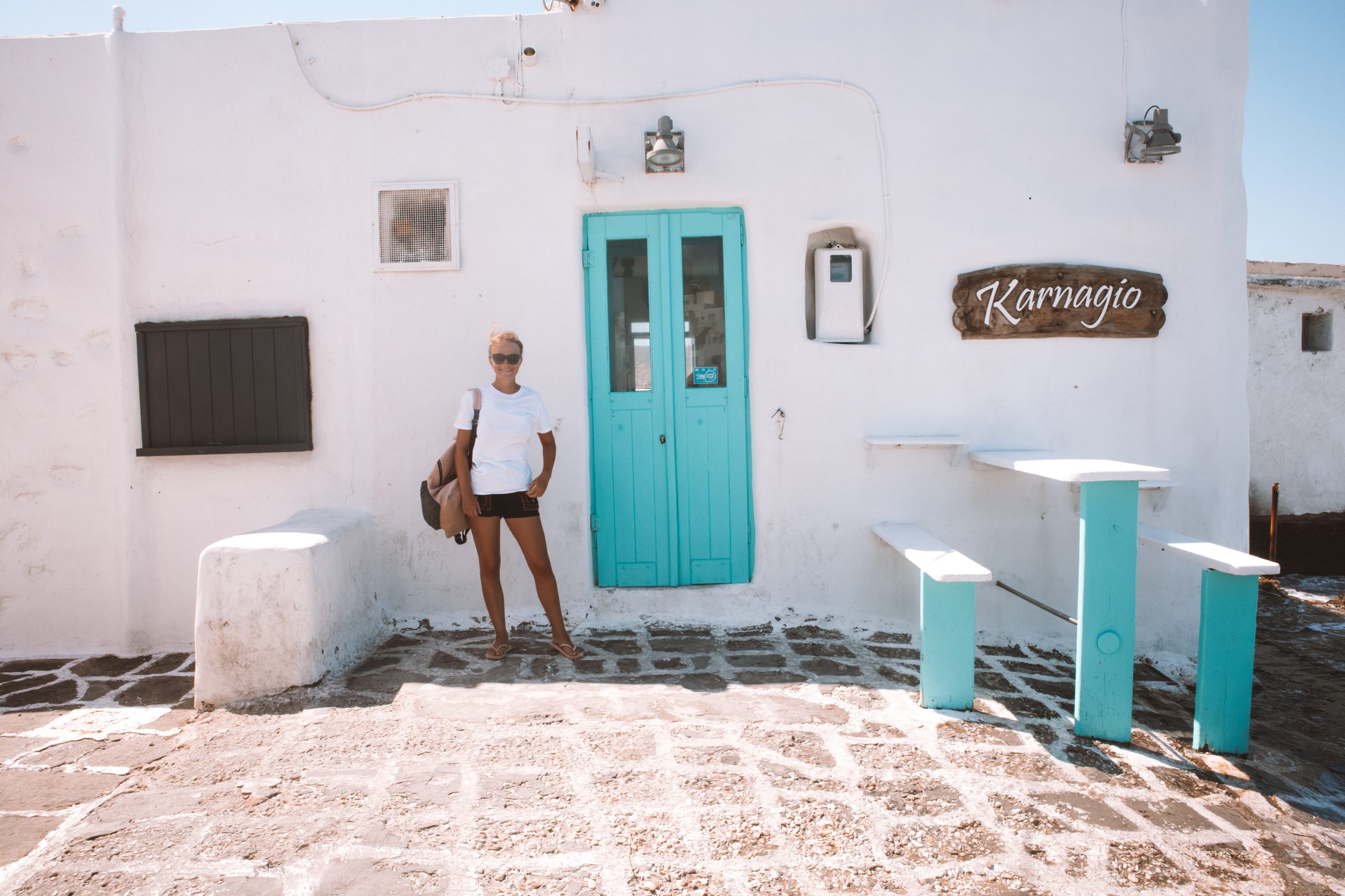 A blue-doored, whitewashed building in Paros. Paros travel blog